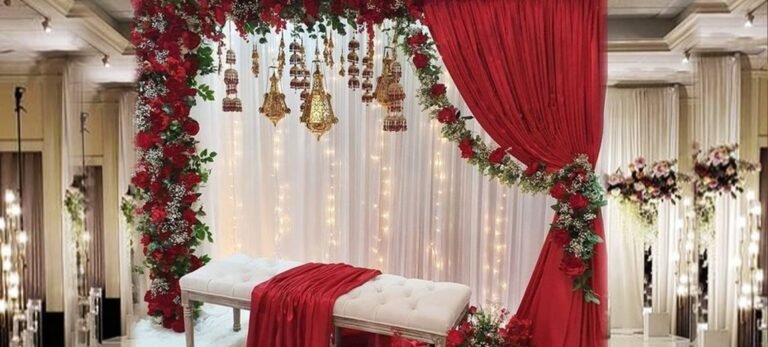 A red curtain and white drapes